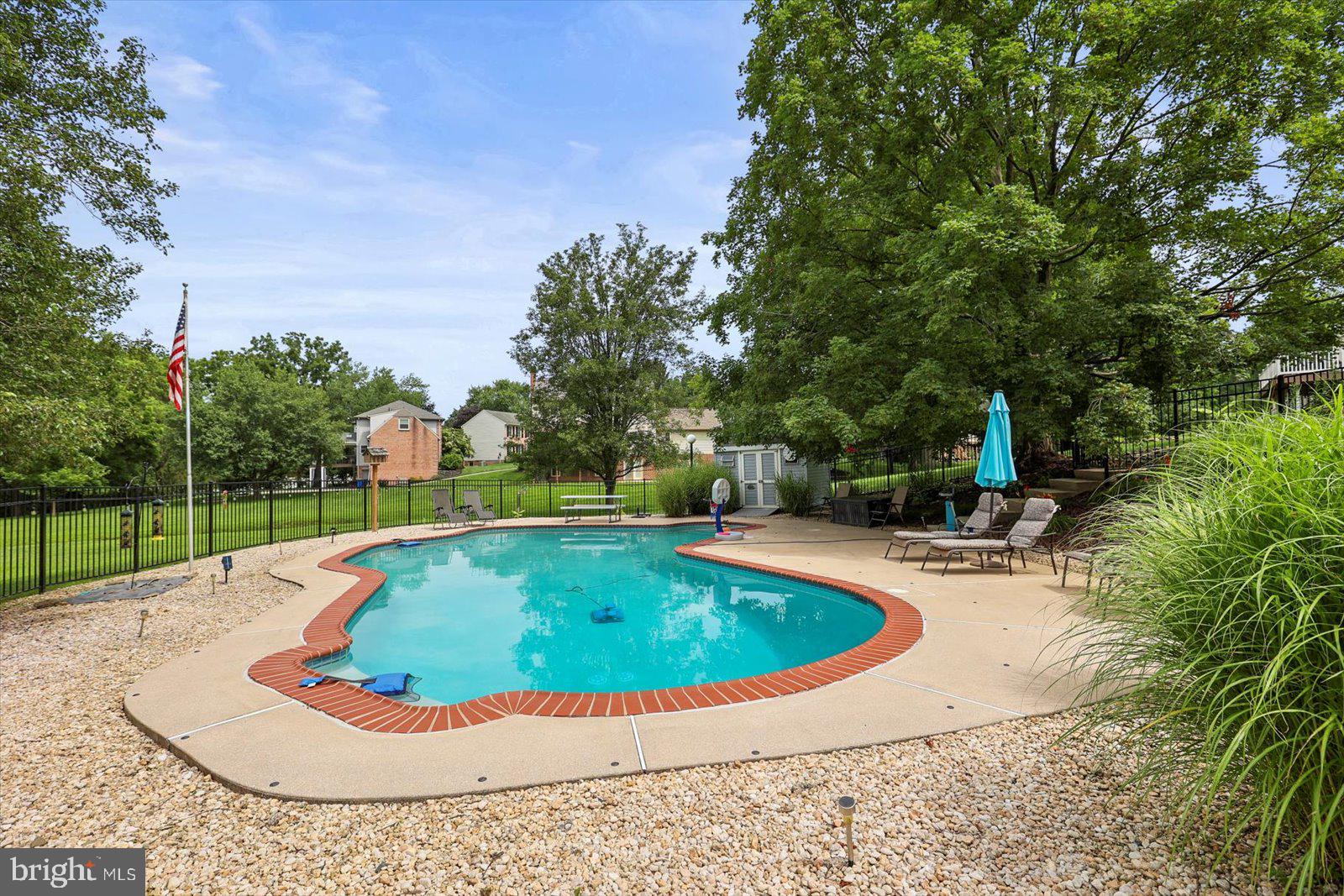 124 Lexington Road York, PA 17402 - Photo 42 of 56 a view of a swimming pool with a yard