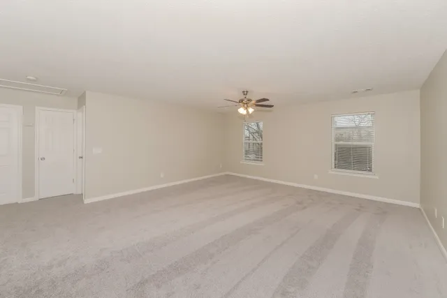 a view of empty room with windows