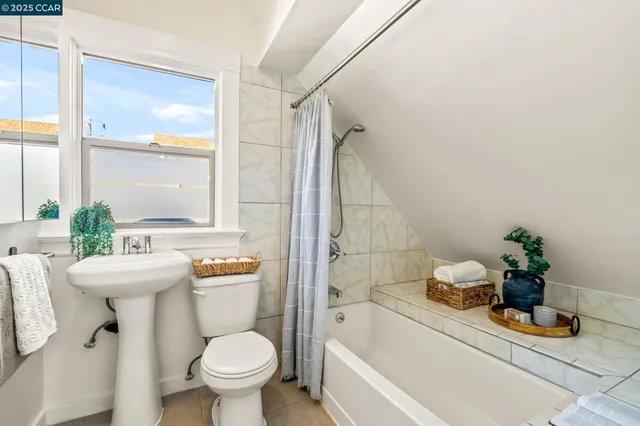 a kitchen with granite countertop a table chairs and a sink