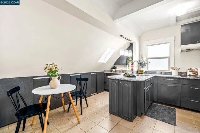 a view of a street with cars parked