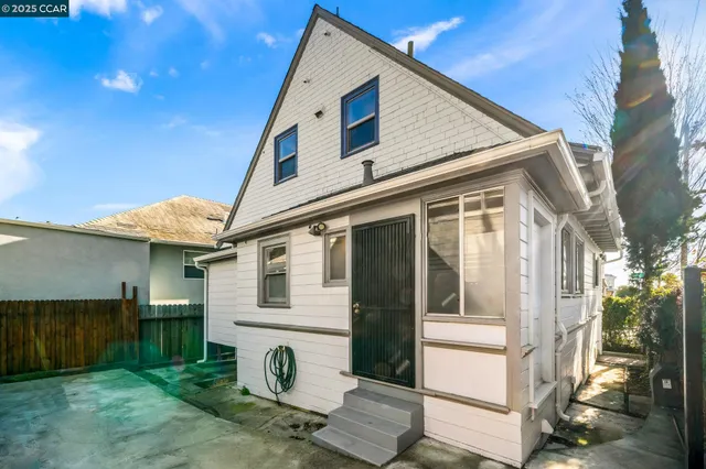 a view of a backyard with sitting area