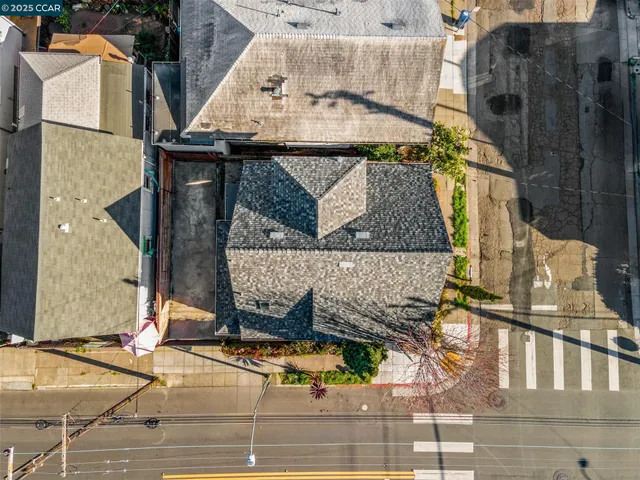 a front view of a house with a garden and plants