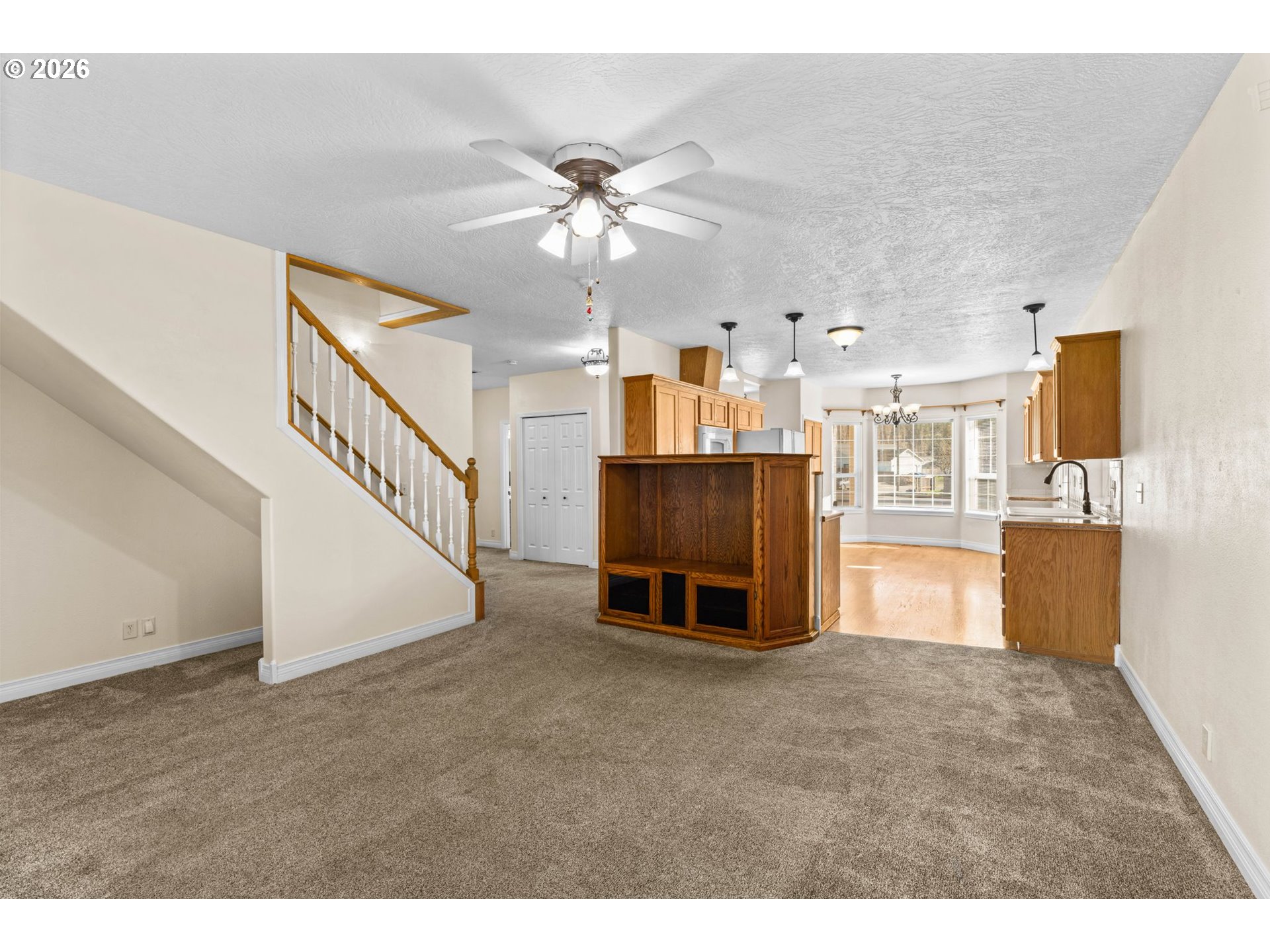 6540 B Street Springfield, OR 97478 - Photo 16 of 48 a living room with stainless steel appliances kitchen view and living room view