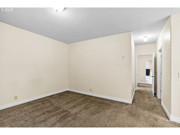 a view of a bedroom with a hallway