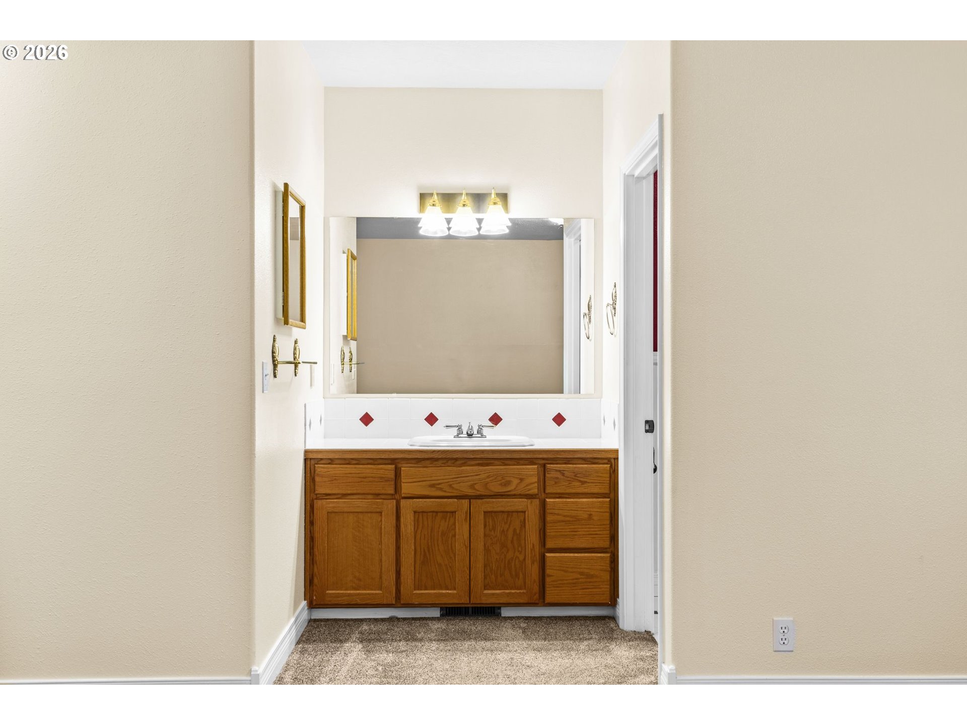 6540 B Street Springfield, OR 97478 - Photo 28 of 48 a bathroom with a sink mirror and a bathtub