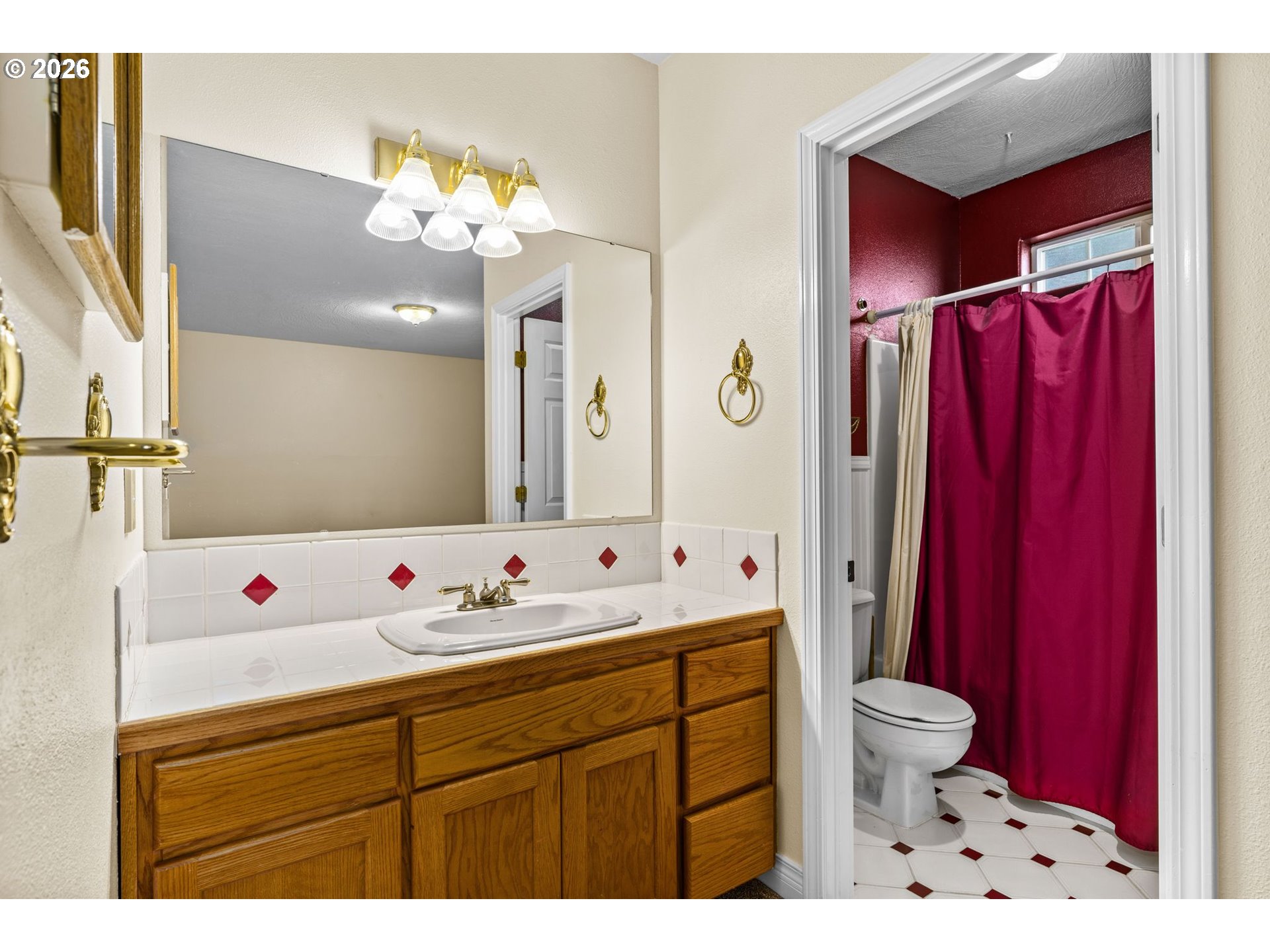 6540 B Street Springfield, OR 97478 - Photo 29 of 48 a bathroom with a sink mirror vanity and toilet