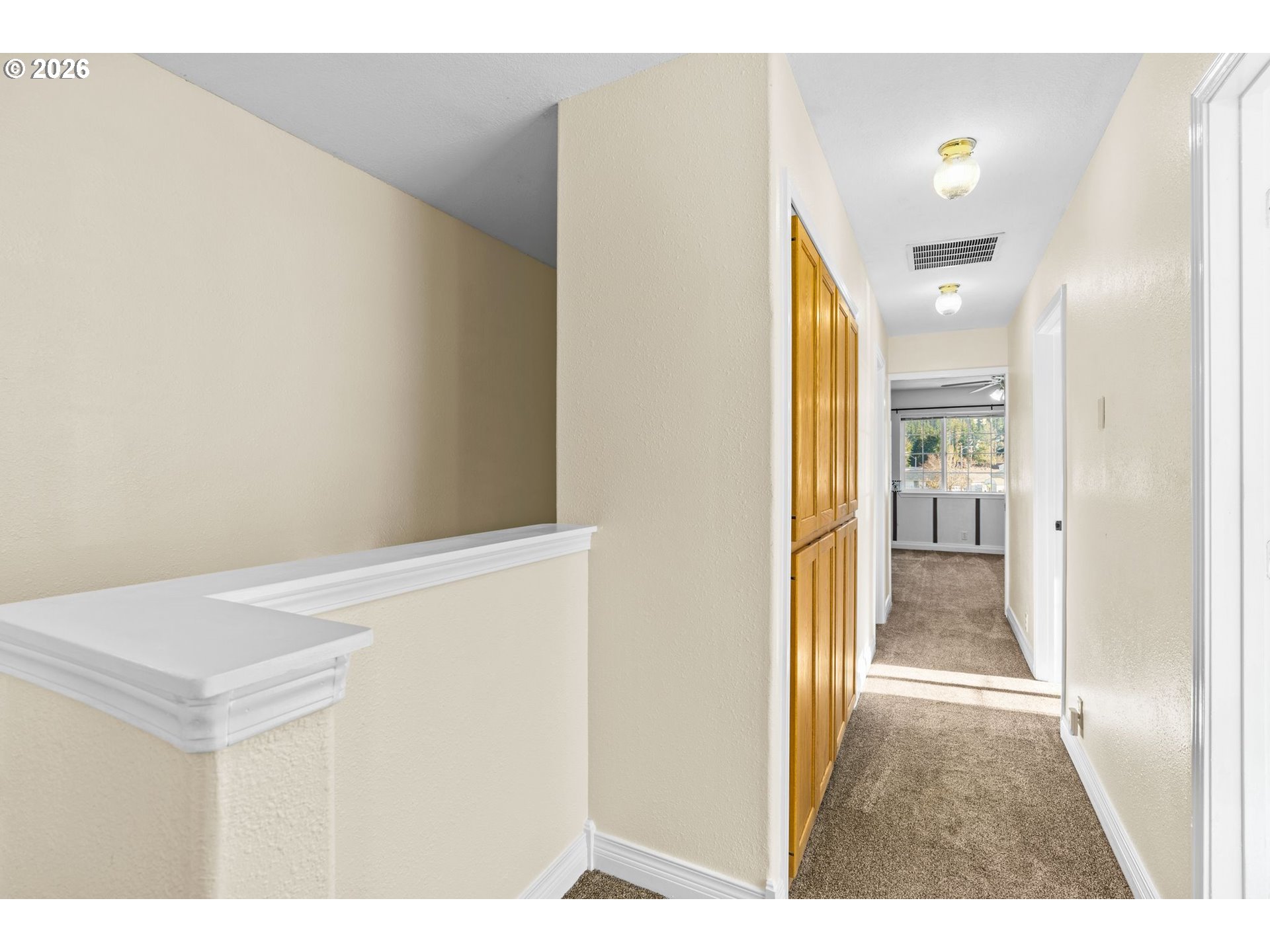 6540 B Street Springfield, OR 97478 - Photo 32 of 48 a view of a hallway with wooden floor and bathroom