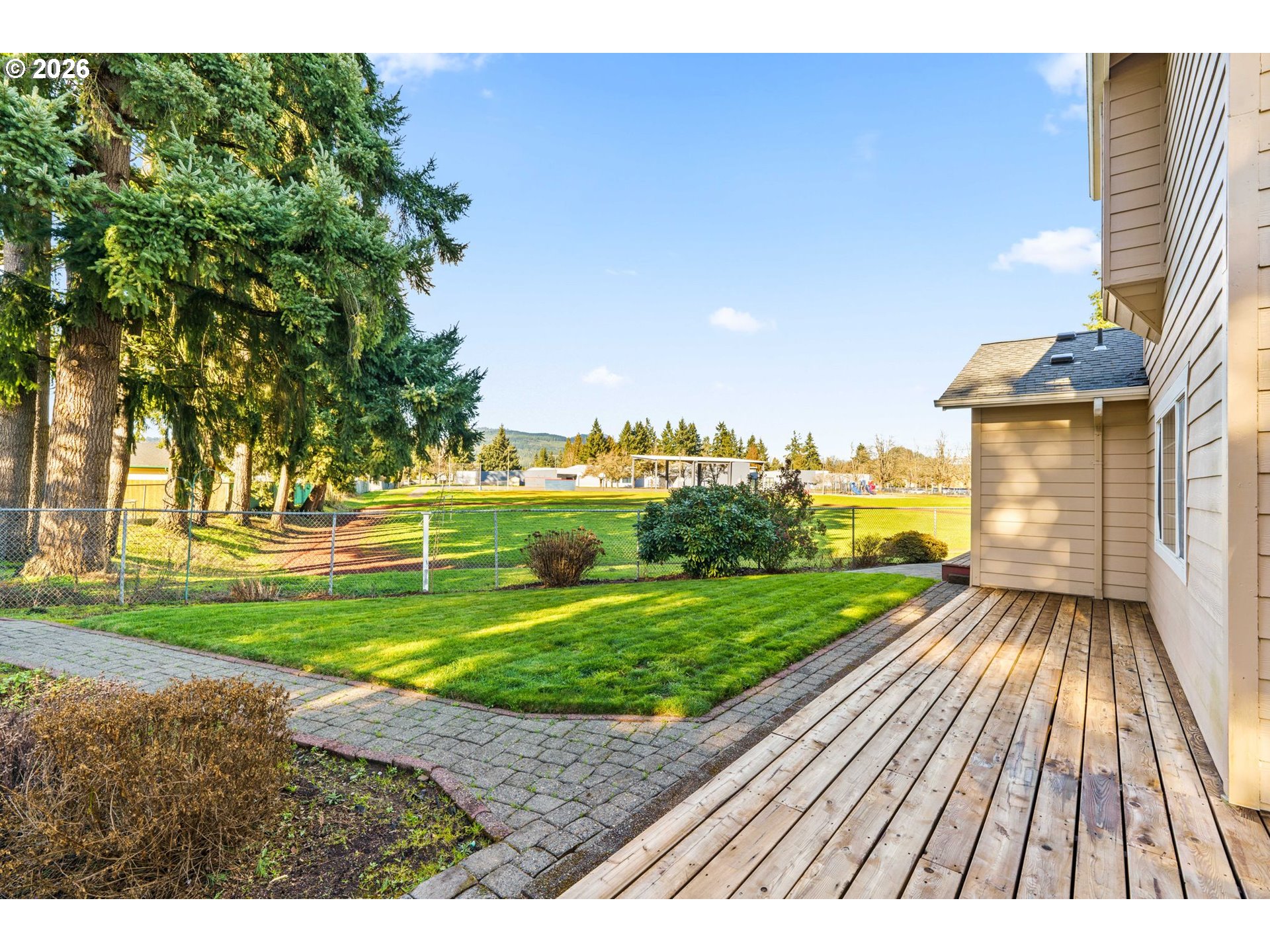 6540 B Street Springfield, OR 97478 - Photo 41 of 48 a view of a backyard with wooden fence