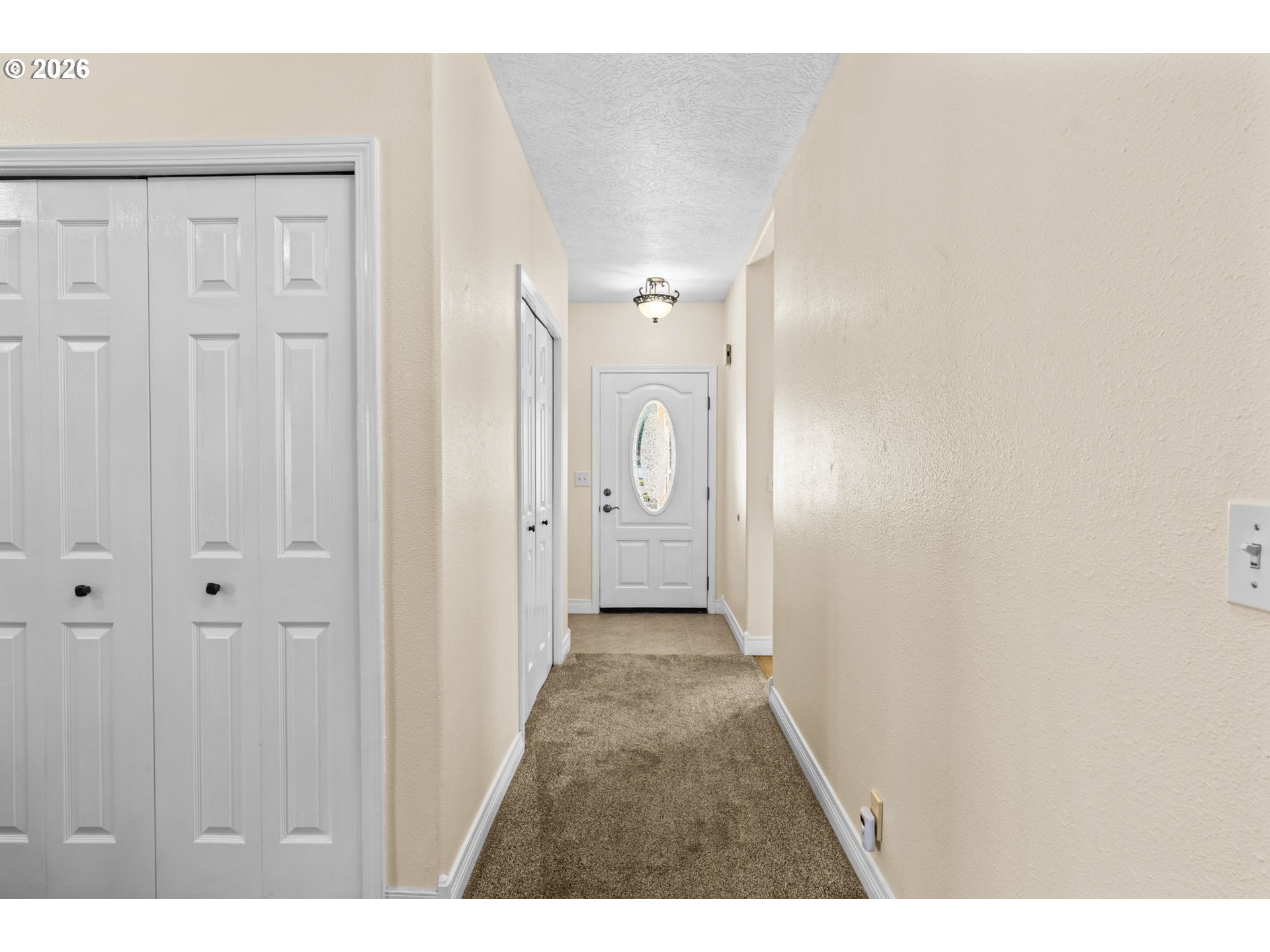 6540 B Street Springfield, OR 97478 - Photo 5 of 48 a view of a hallway with wooden floor