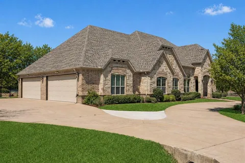 a view of house with yard and green space