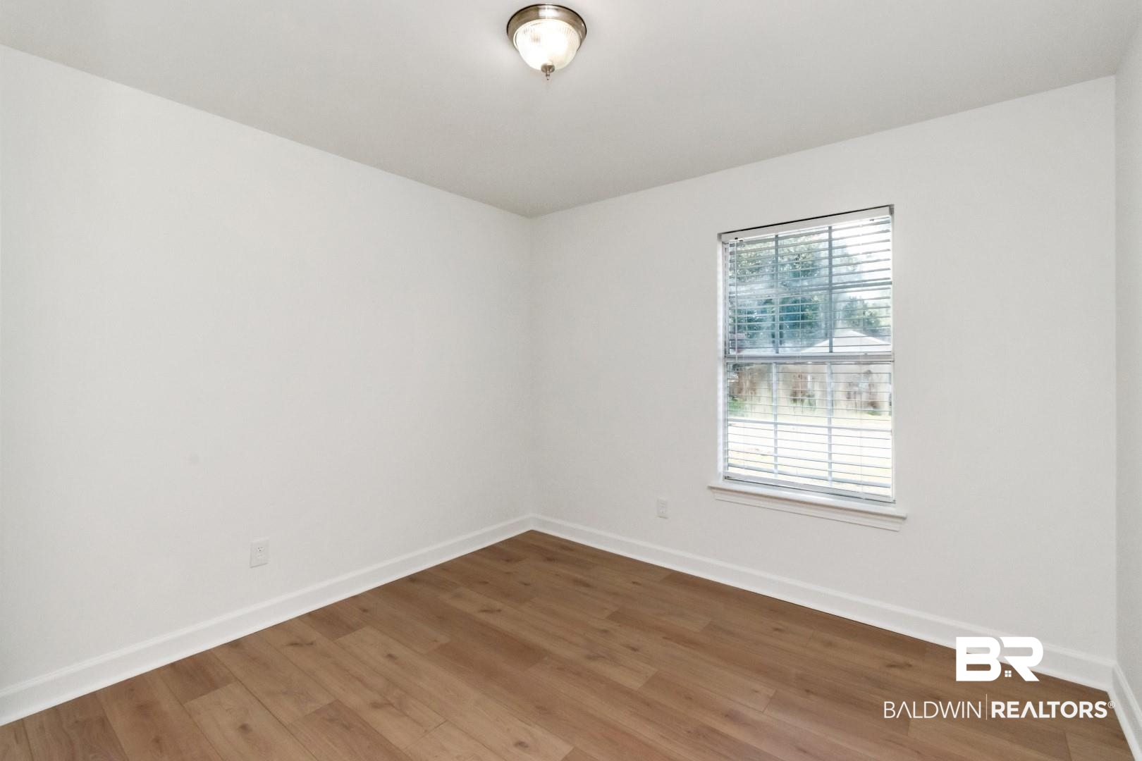 1611 Rochelle Street Mobile, AL 36693 - Photo 11 of 32 Empty room with baseboards and wood finished floors