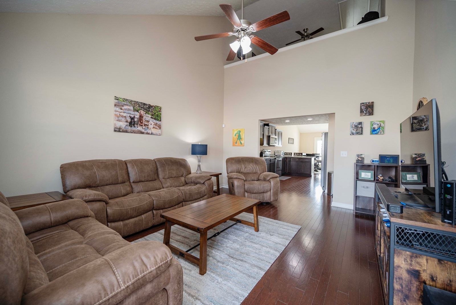 3448 Risen Star Drive Murfreesboro, TN 37128 - Photo 2 of 19 a living room with furniture a wooden floor and a chandelier