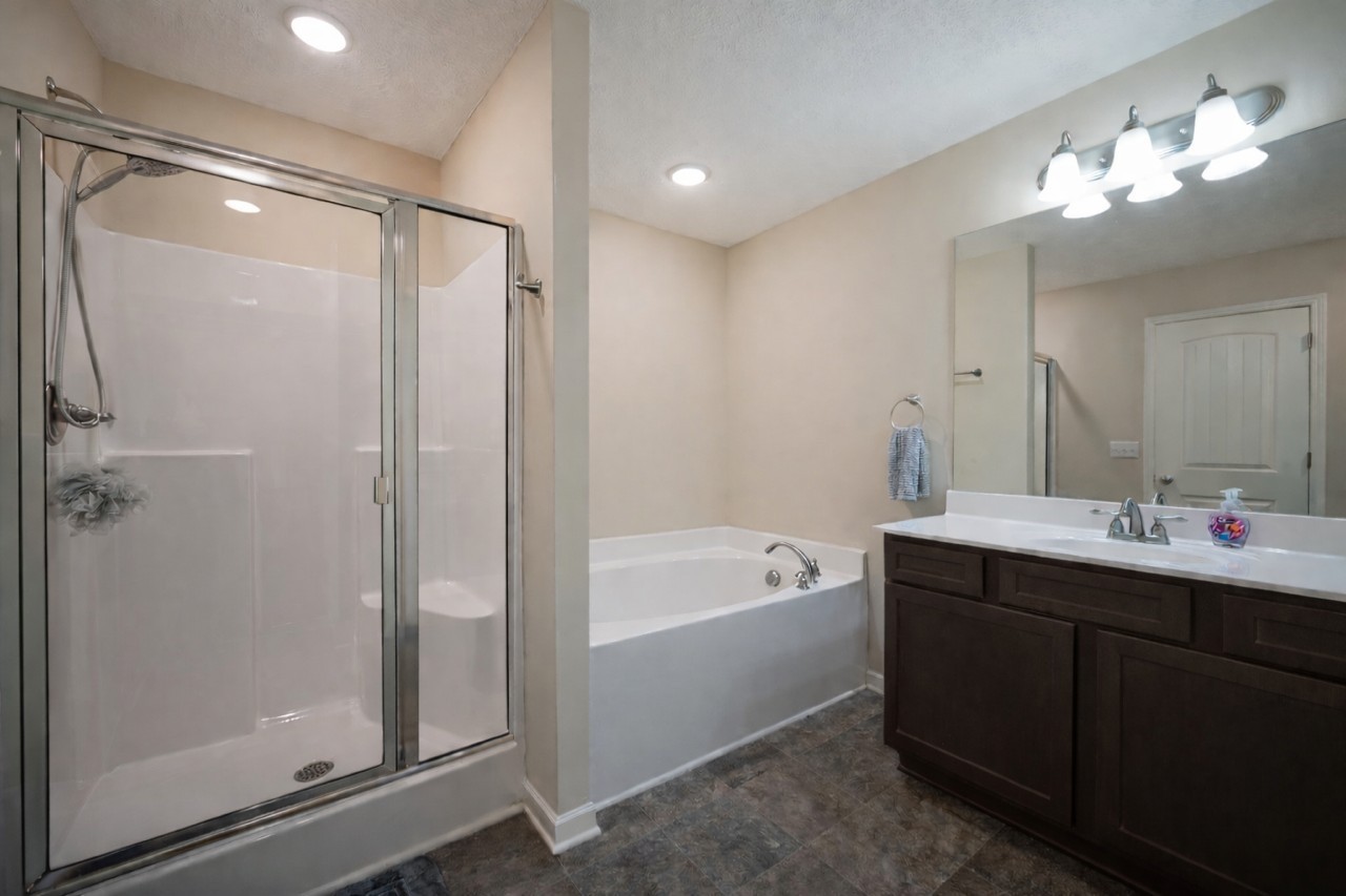 3448 Risen Star Drive Murfreesboro, TN 37128 - Photo 10 of 19 a bathroom with a tub a sink shower and mirror