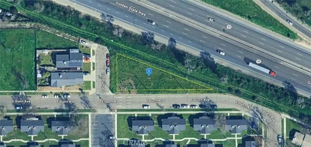 a backyard of a house with lots of green space and outdoor seating