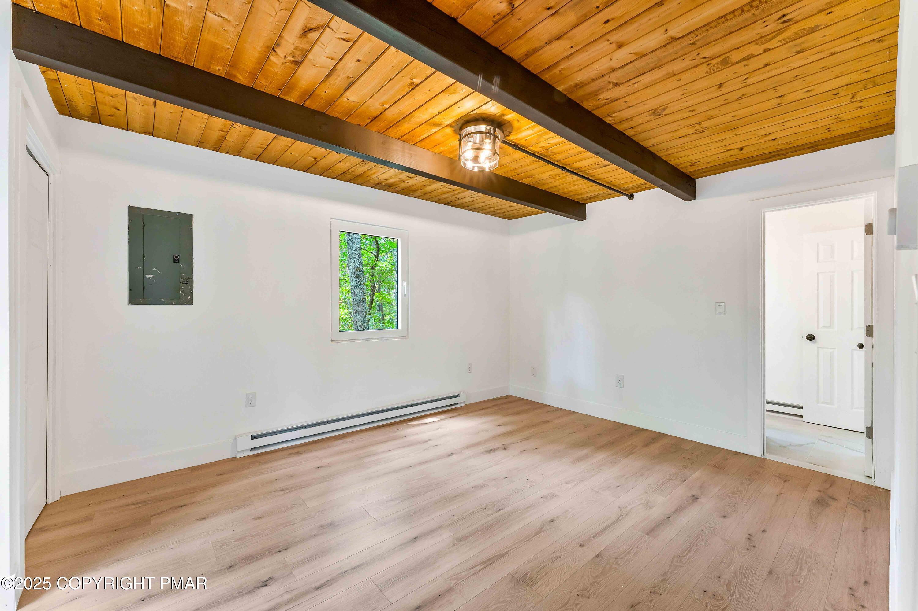 151 Elgin Way Bushkill, PA 18324 - Photo 35 of 60 a view of empty room with wooden floor and fan