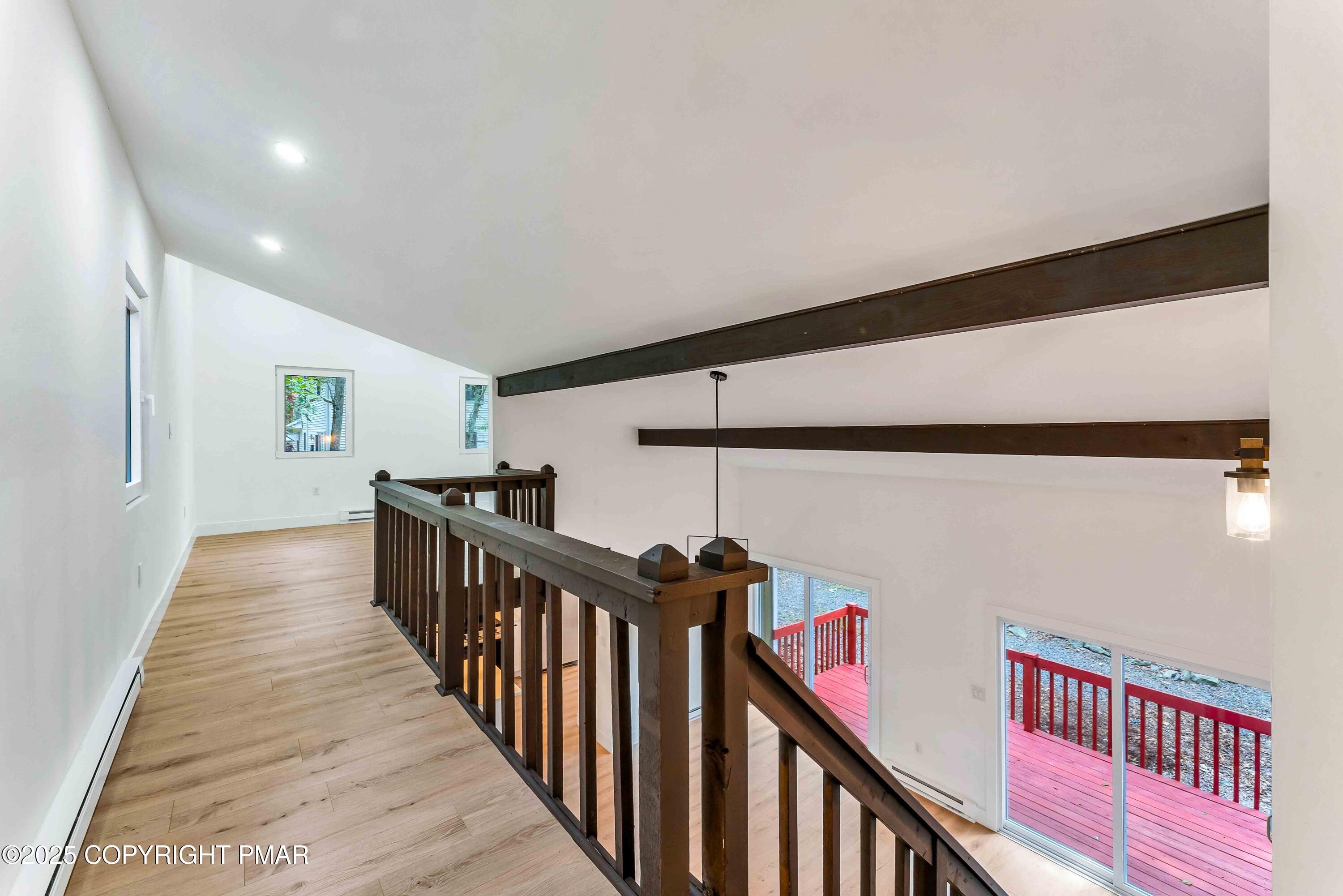151 Elgin Way Bushkill, PA 18324 - Photo 38 of 60 a view of a hallway with wooden floor and stairs