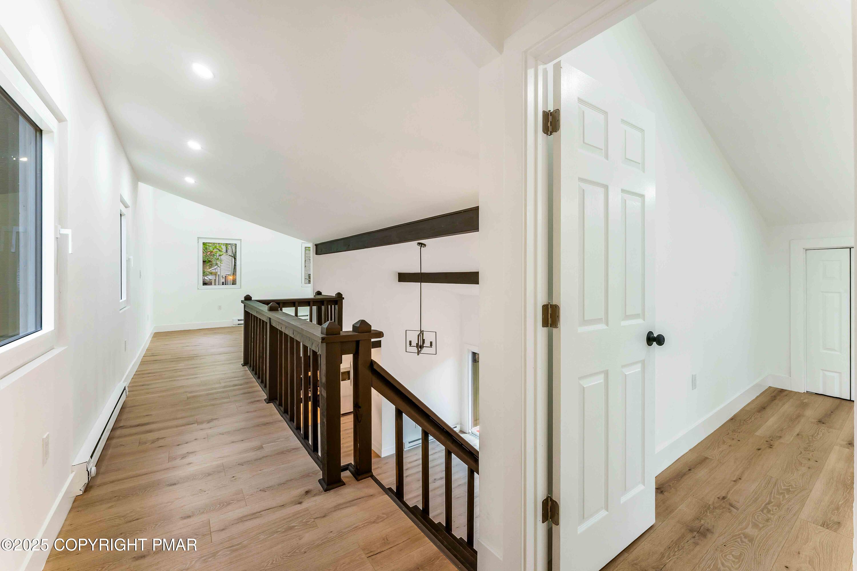151 Elgin Way Bushkill, PA 18324 - Photo 39 of 60 a view of a hallway with wooden floor and windows
