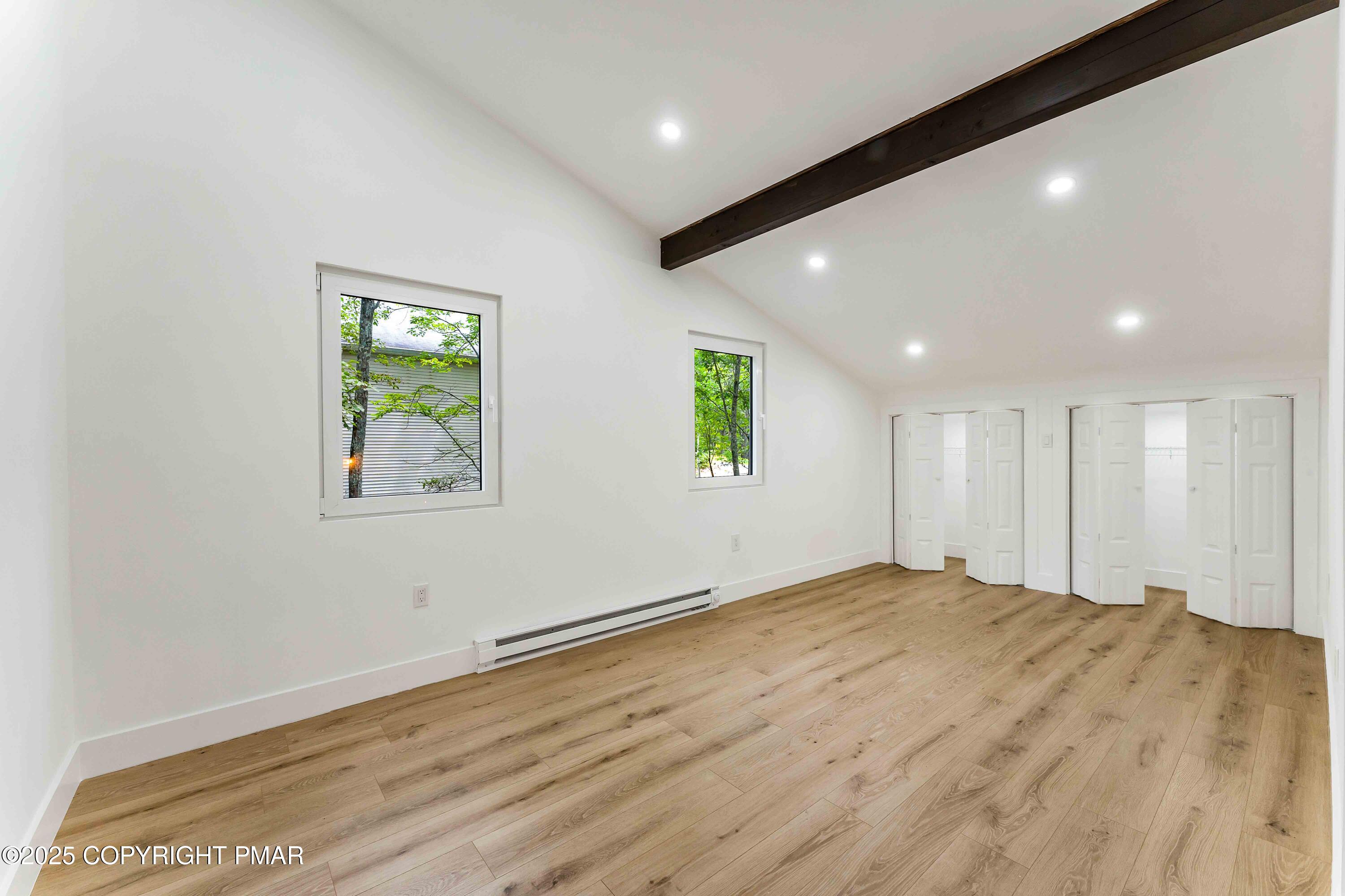 151 Elgin Way Bushkill, PA 18324 - Photo 44 of 60 a view of an empty room with window and wooden floor