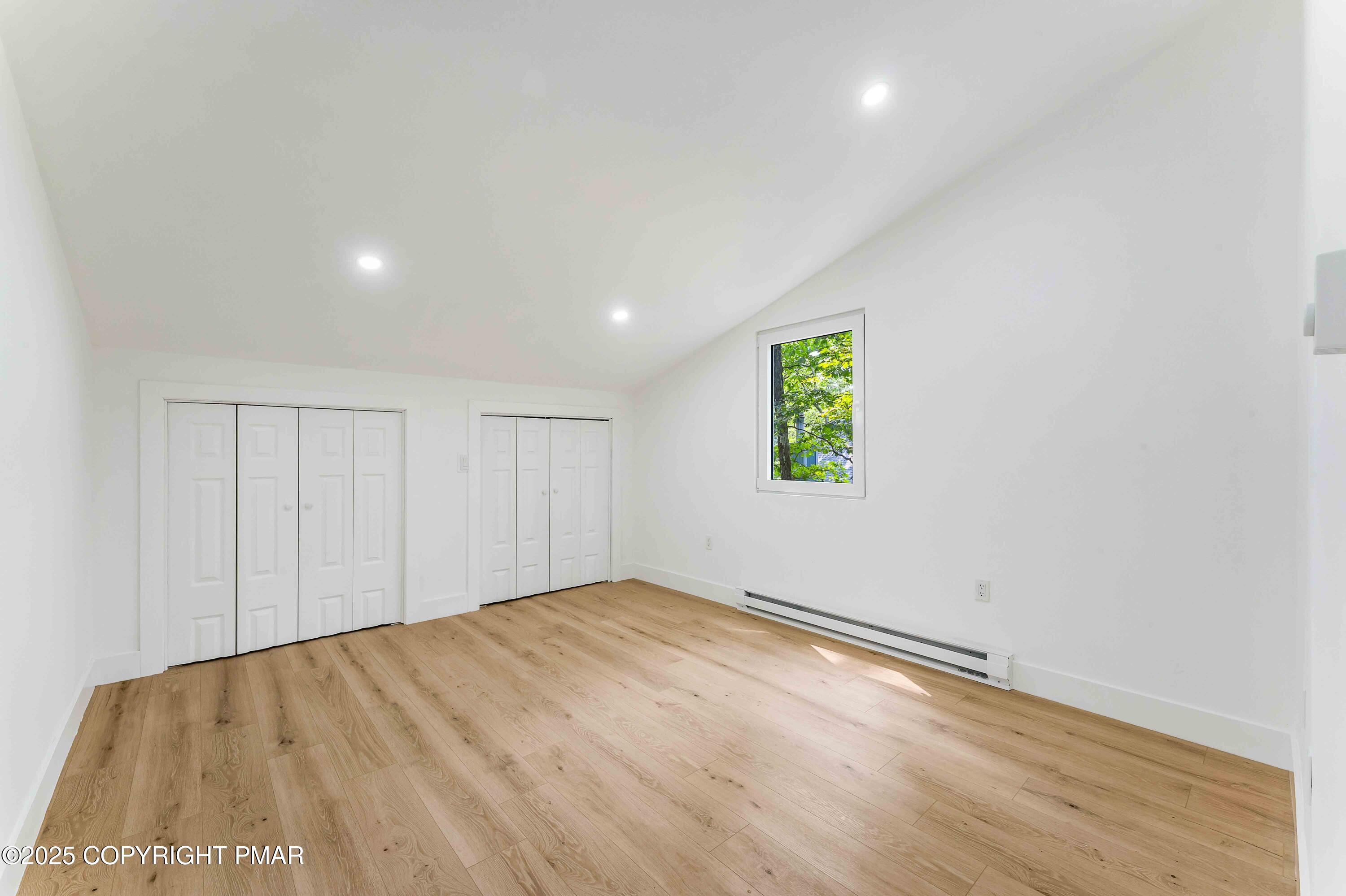 151 Elgin Way Bushkill, PA 18324 - Photo 49 of 60 a view of empty room with wooden floor and fan