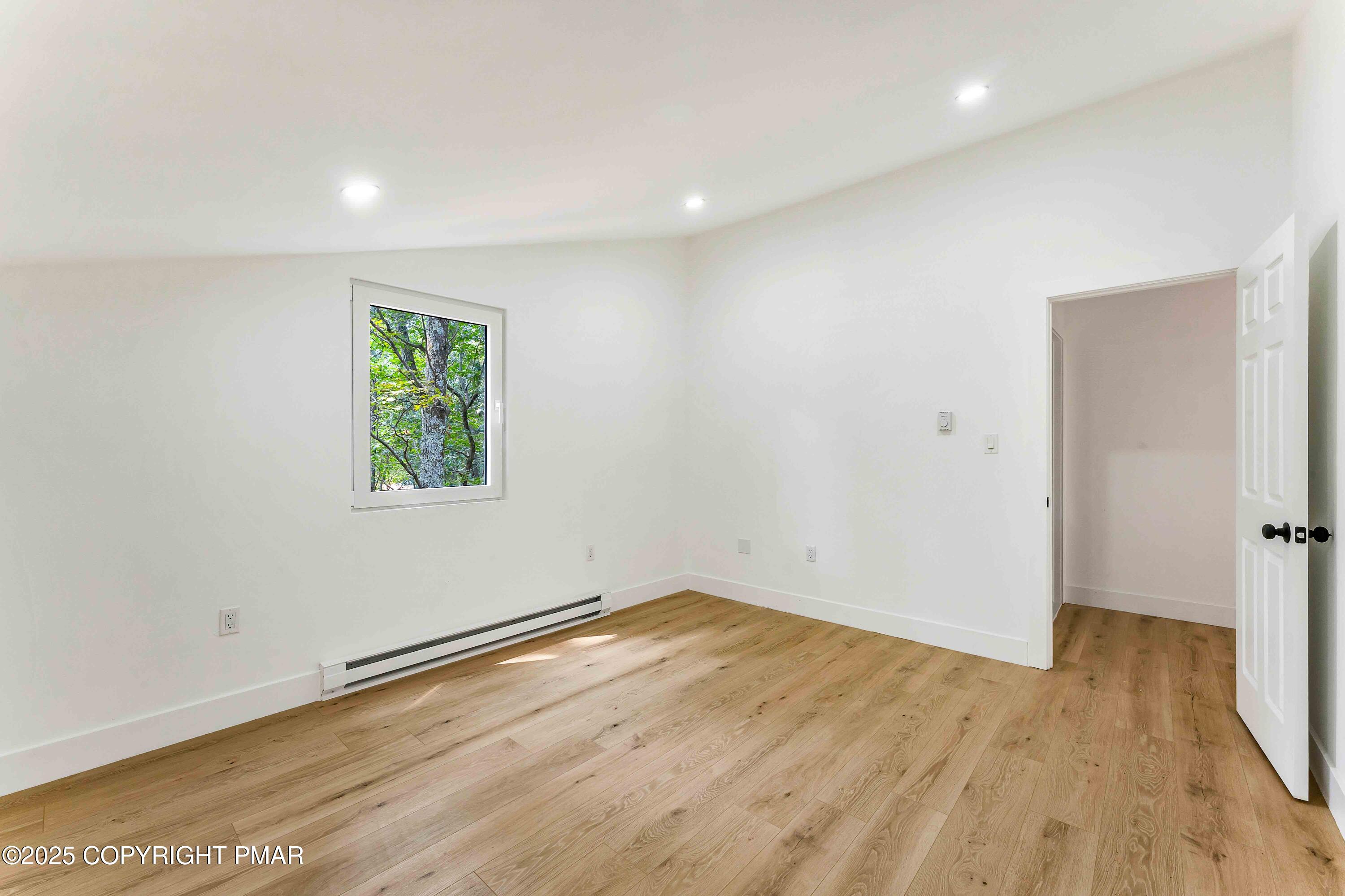 151 Elgin Way Bushkill, PA 18324 - Photo 51 of 60 an empty room with wooden floor and window