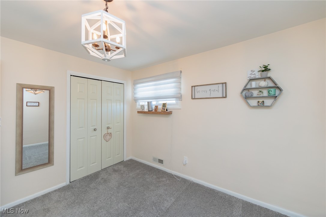 6901 Revere Road Cleveland, OH 44130 - Photo 29 of 50 Unfurnished bedroom featuring carpet and a closet