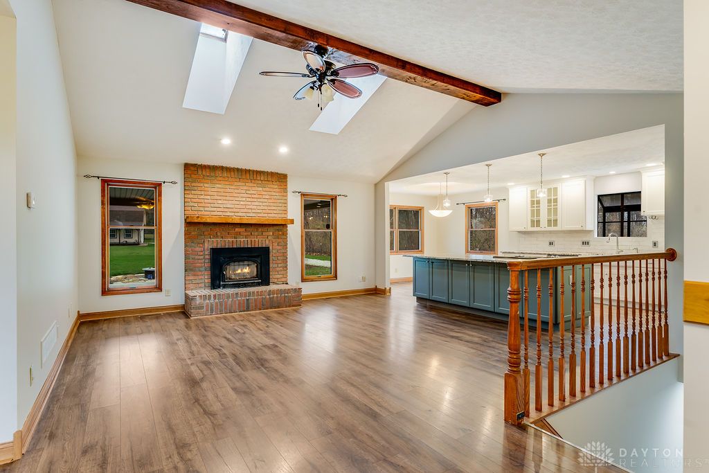7400 Cook-Jones Road Waynesville, OH 45068 - Photo 18 of 72 This inviting space features an open layout, a cozy fireplace, and abundant natural light.