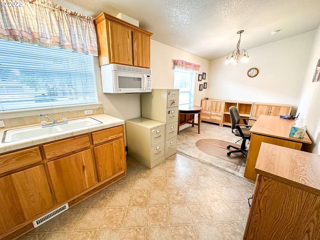 46198 Slaughterhouse Road Halfway, OR 97834 - Photo 22 of 40 a kitchen that has a sink and a stove