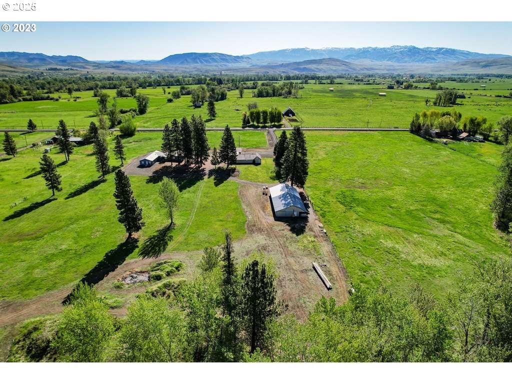 46198 Slaughterhouse Road Halfway, OR 97834 - Photo 5 of 40 a view of a lush green hillside and houses