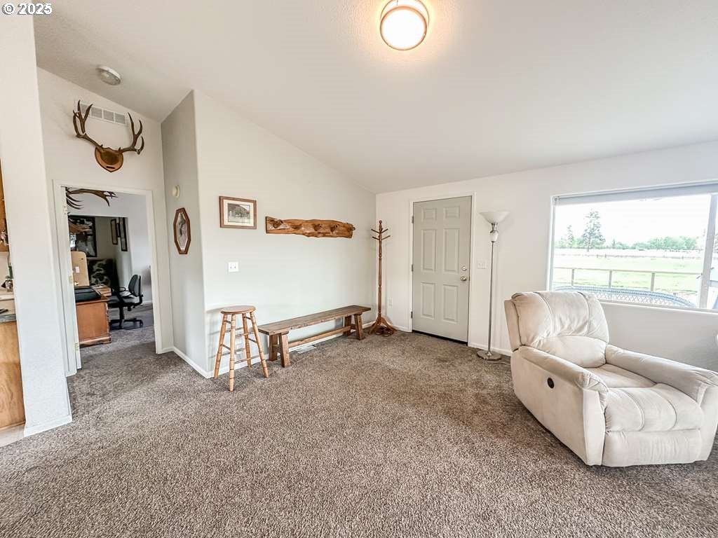 46198 Slaughterhouse Road Halfway, OR 97834 - Photo 10 of 40 a living room with furniture and a large window