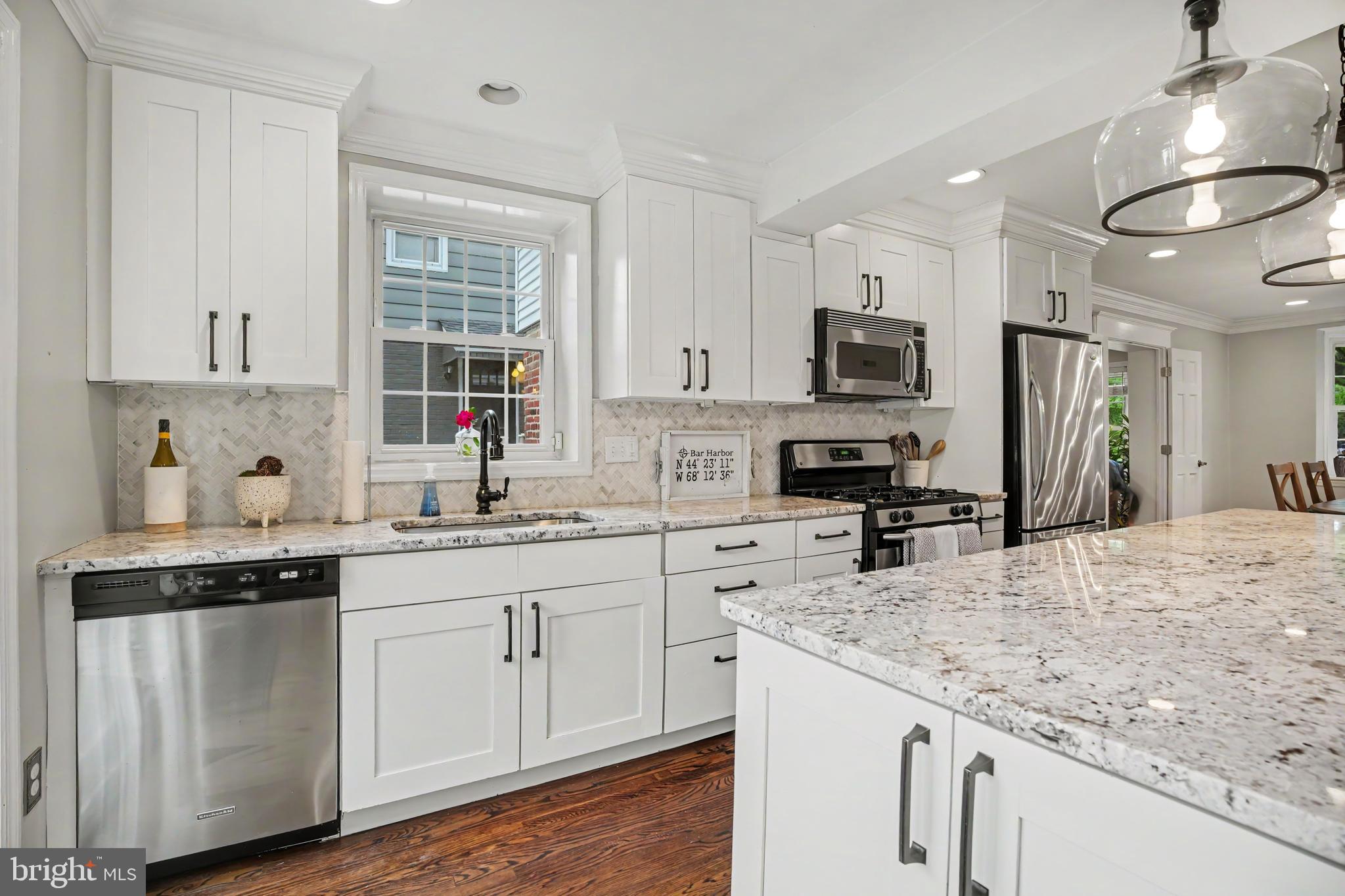 235 Hopkins Road Haddonfield, NJ 08033 - Photo 12 of 47 a kitchen with granite countertop a sink stove and refrigerator