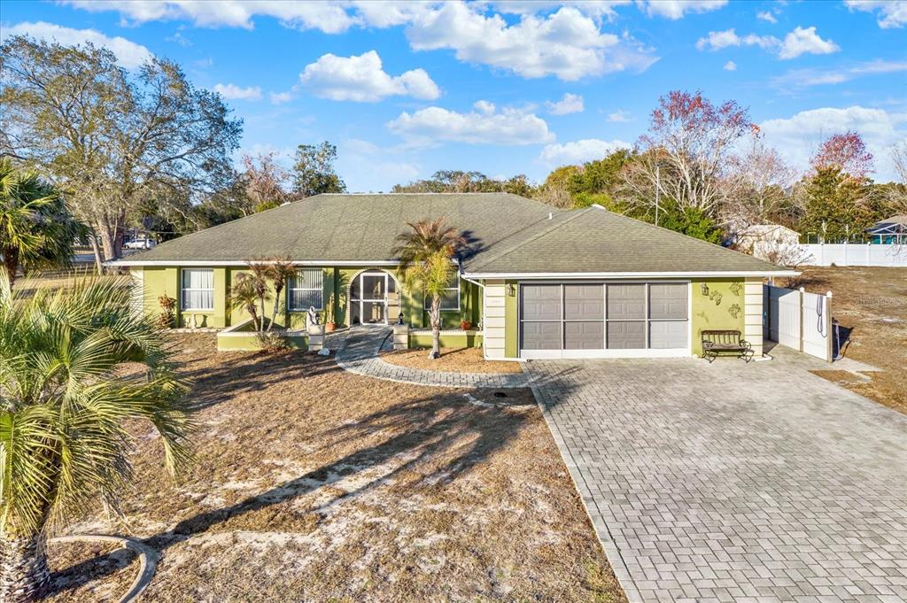 a view of a house with a yard and balcony