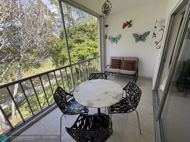 a view of a balcony with chairs
