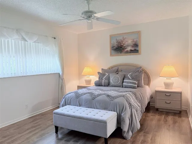 a bedroom with a bed and a lamp