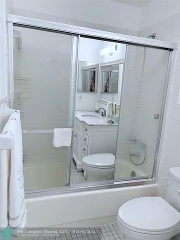 a bedroom with a bed and a closet