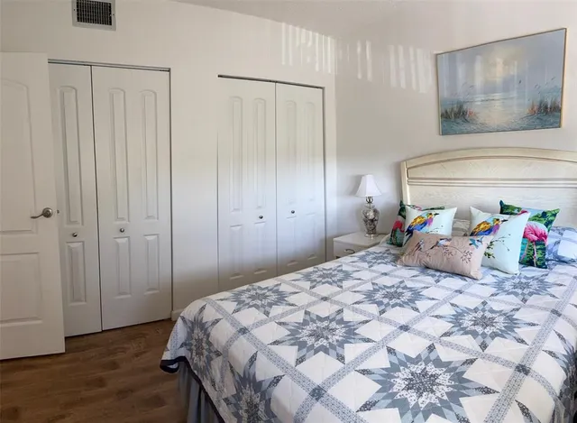 a bedroom with a bed and a closet