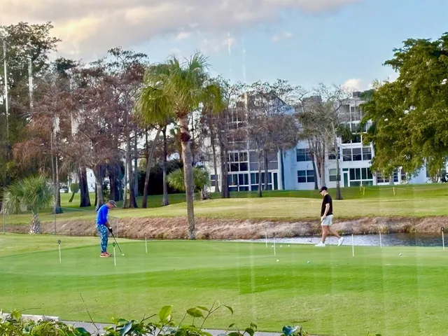 a view of a park with swings and slides