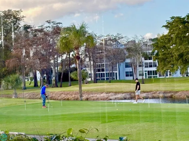 a view of a multi story building in front of a house