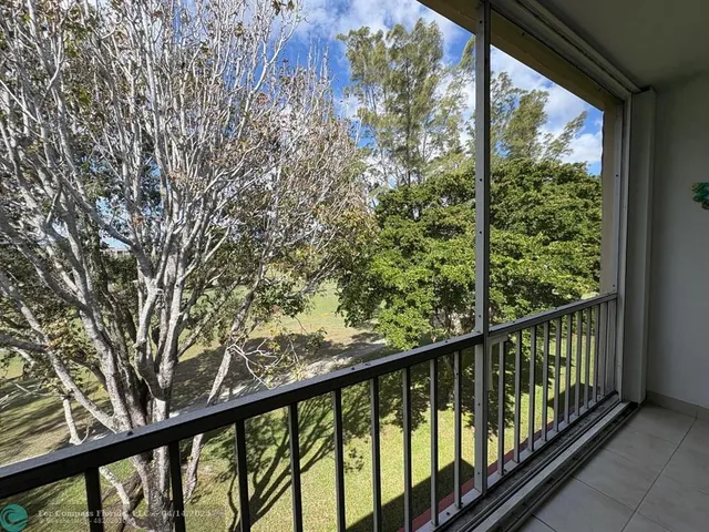 a kitchen with stainless steel appliances granite countertop white cabinets a sink and dishwasher
