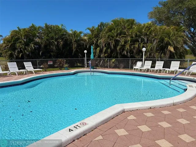 a front view of a house with yard and entryway