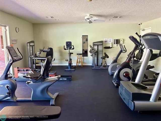 a kitchen with stainless steel appliances granite countertop a sink and a refrigerator