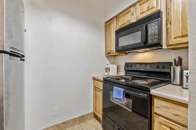a kitchen with a stove and a microwave