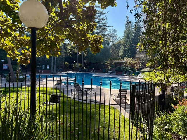 a view of a swimming pool and deck