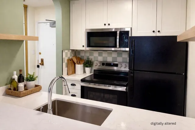 a kitchen with a refrigerator stove and microwave