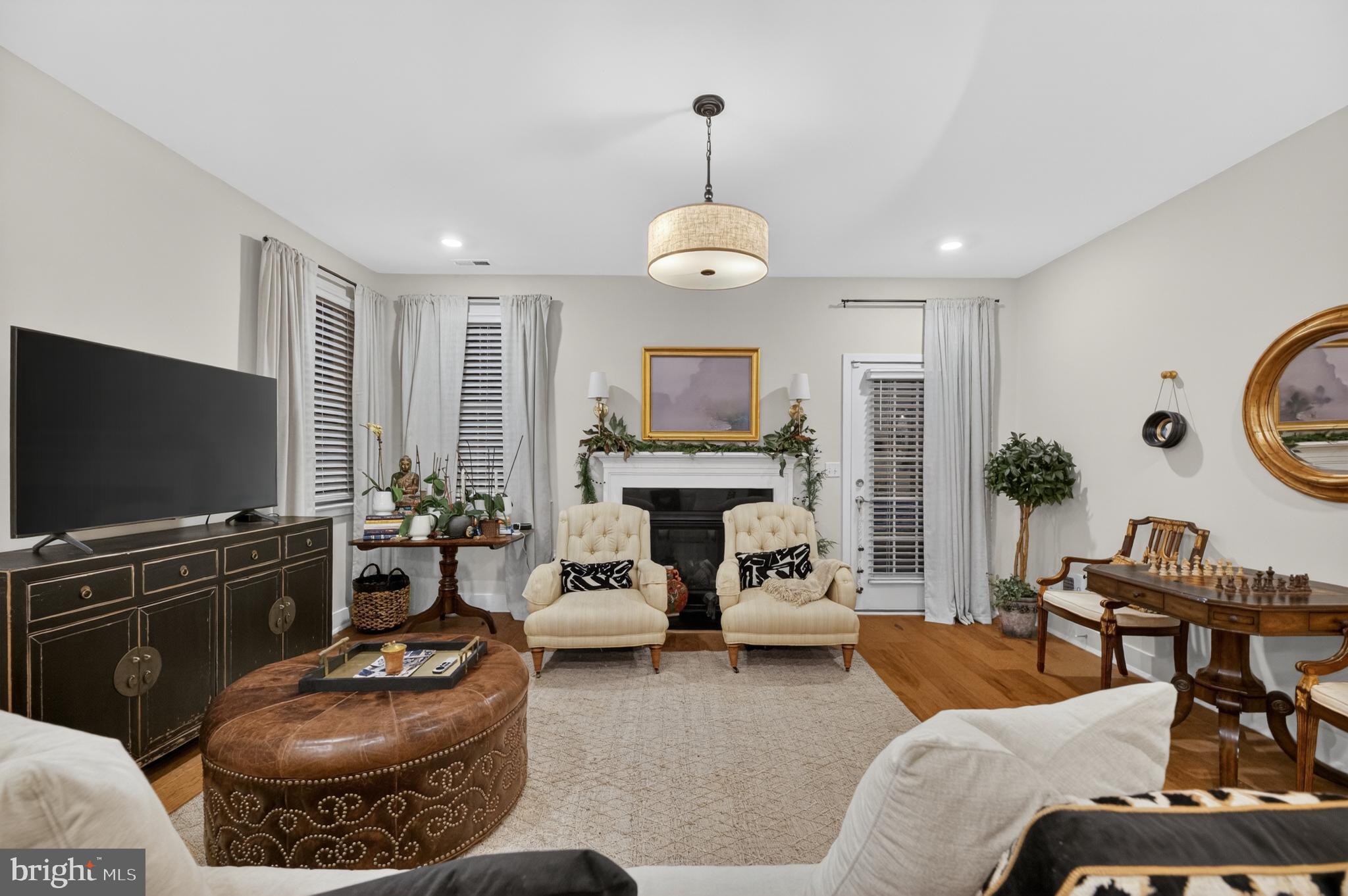 35 Saratoga Road New Egypt, NJ 08533 - Photo 13 of 52 a living room with furniture a fireplace and a flat screen tv
