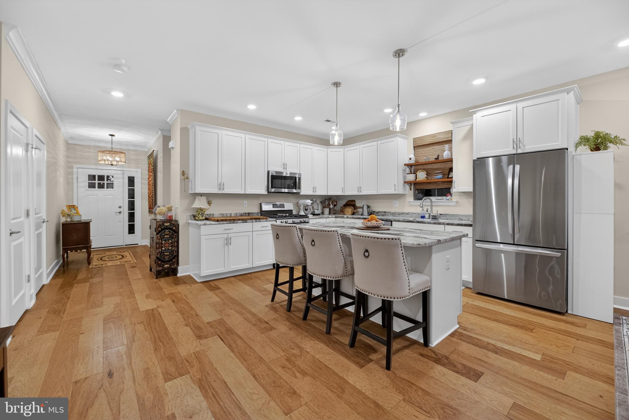 35 Saratoga Road New Egypt, NJ 08533 - Photo 16 of 52 a kitchen with stainless steel appliances a refrigerator a stove top oven and a center island