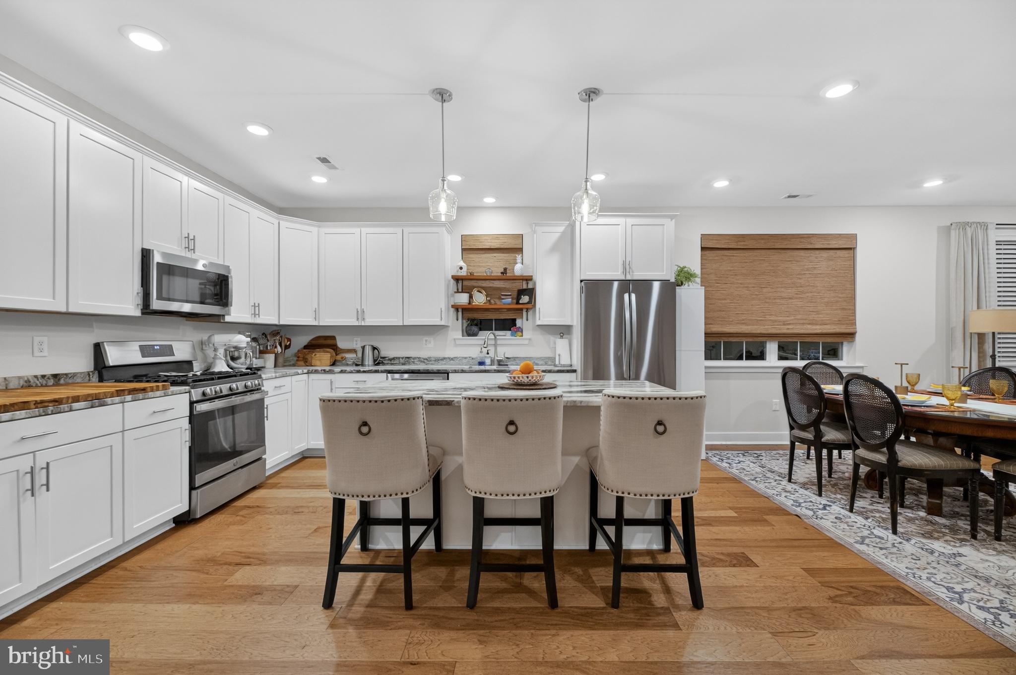 35 Saratoga Road New Egypt, NJ 08533 - Photo 17 of 52 a kitchen with stainless steel appliances granite countertop a table chairs sink refrigerator and microwave