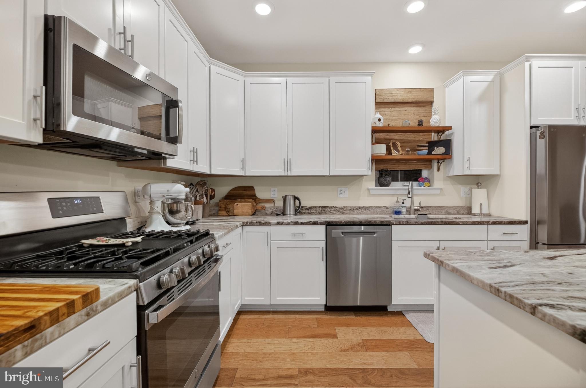 35 Saratoga Road New Egypt, NJ 08533 - Photo 19 of 52 a kitchen with kitchen island granite countertop stainless steel appliances and sink