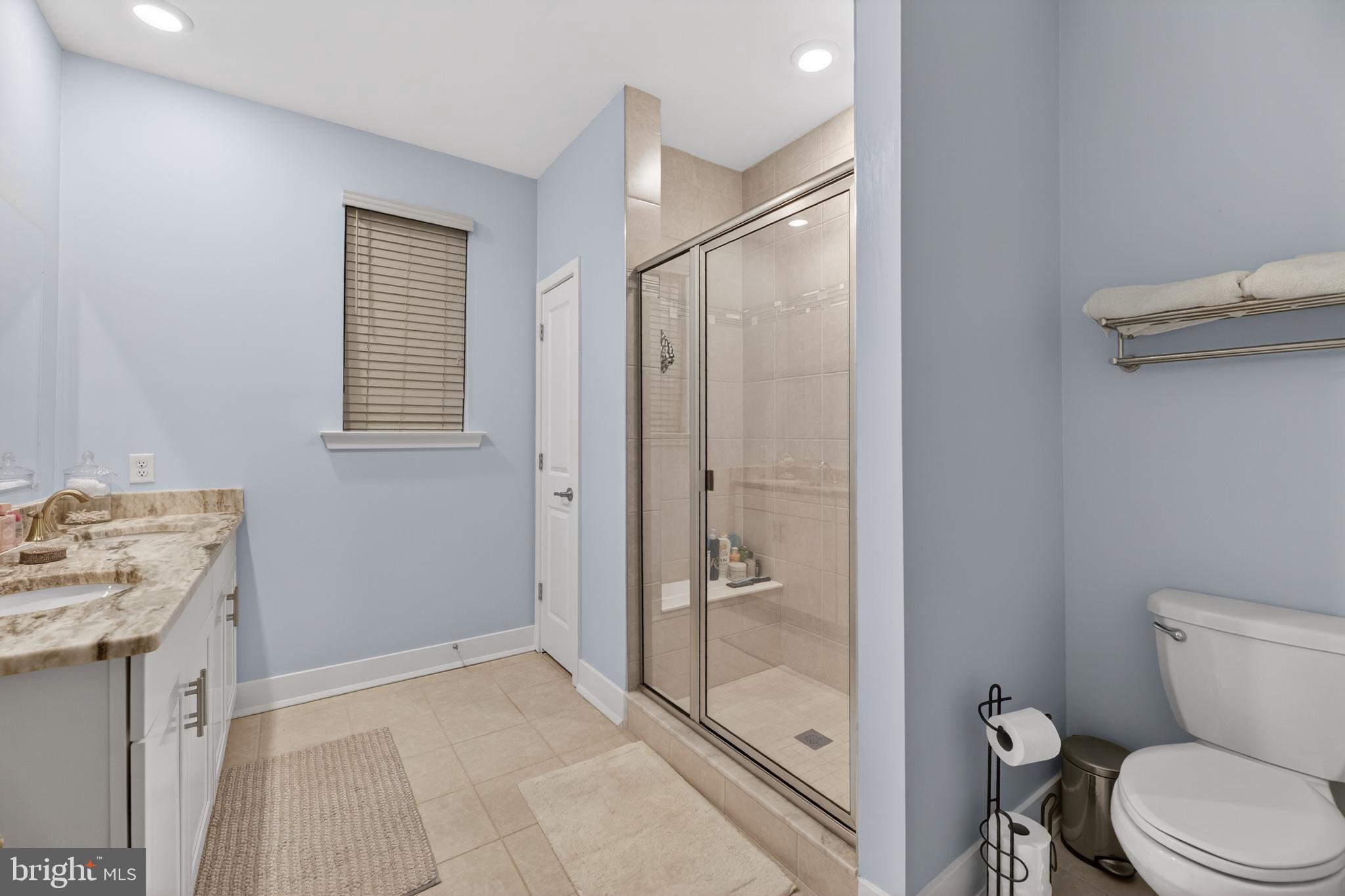 35 Saratoga Road New Egypt, NJ 08533 - Photo 28 of 52 a bathroom with a granite countertop toilet a sink and a shower