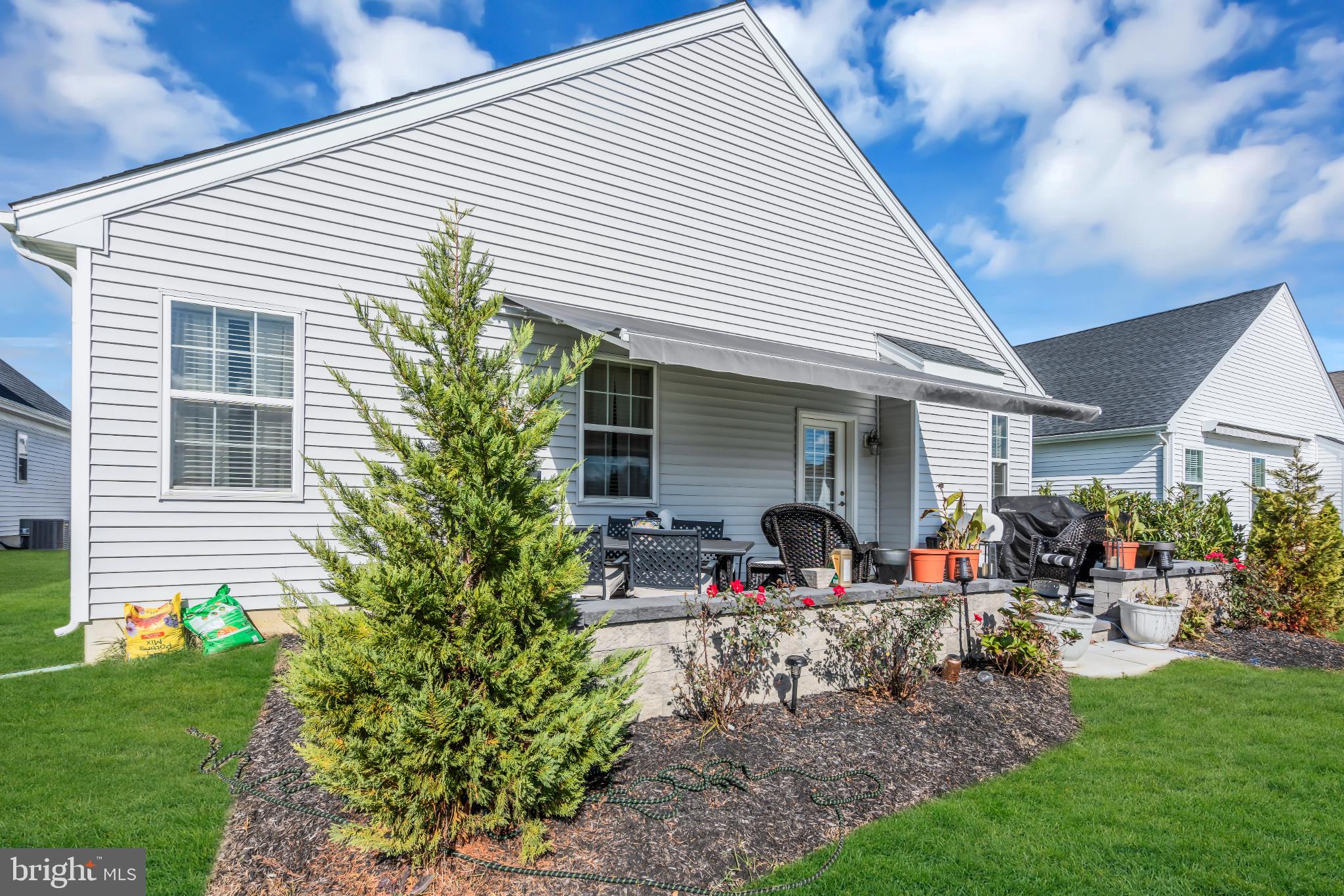 35 Saratoga Road New Egypt, NJ 08533 - Photo 5 of 52 a group of people sitting in front of a house