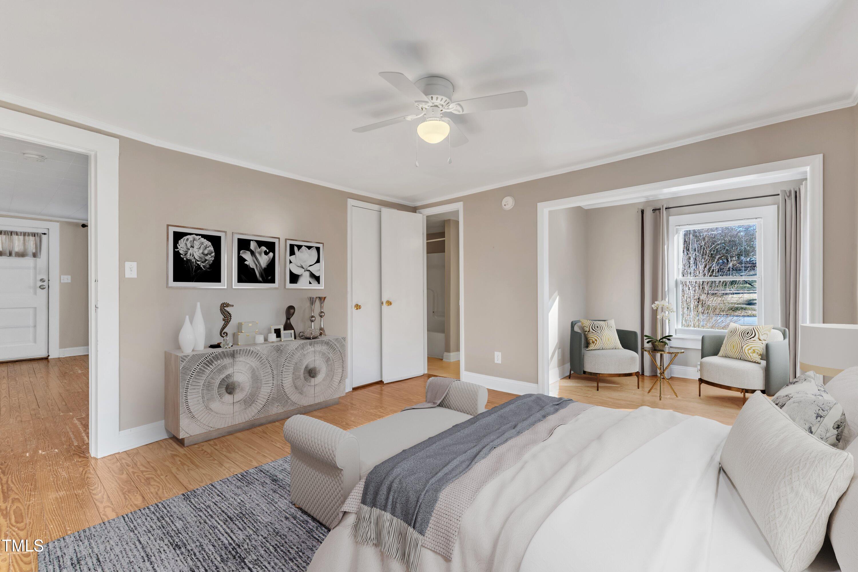 152 East Tryon Street Hillsborough, NC 27278 - Photo 14 of 34 a spacious bedroom with a bed and ceiling fan